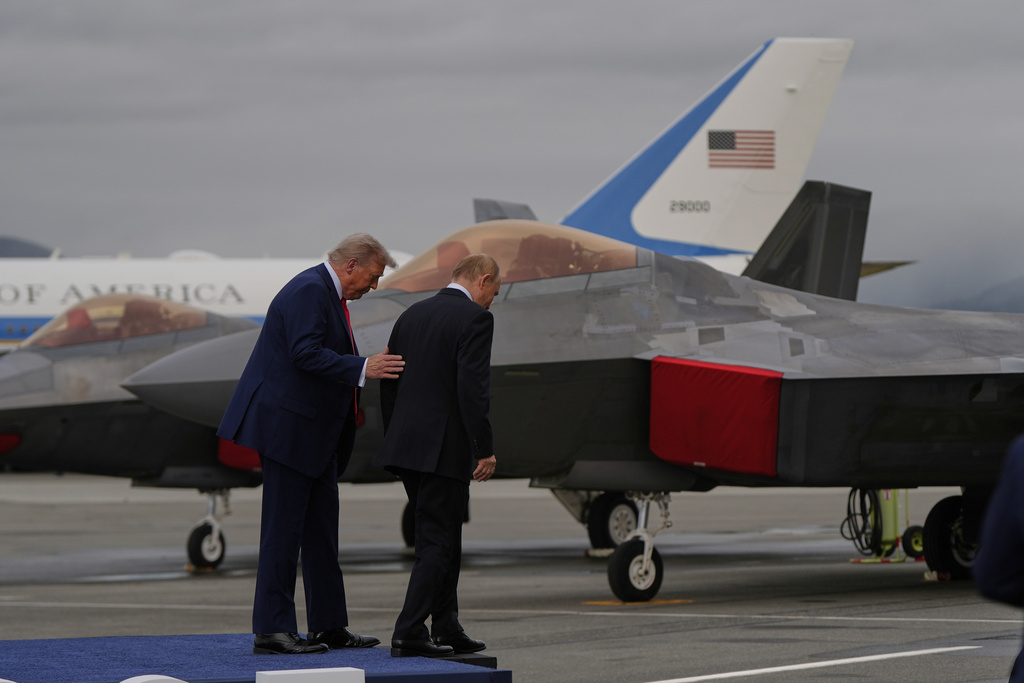 President Donald Trump walks from a stage with Russia's President Vladimir Putin Friday, Aug. 15, 2025, at Joint Base Elmendorf-Richardson, Alaska. (AP Photo/Julia Demaree Nikhinson)