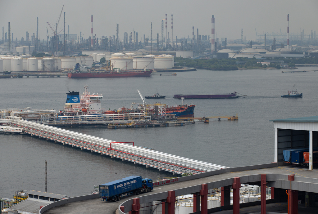 A truck pulls into a parking garage overlooking Jurong Island in Singapore on Oct. 6, 2025. (AP Photo/Anton L. Delgado)