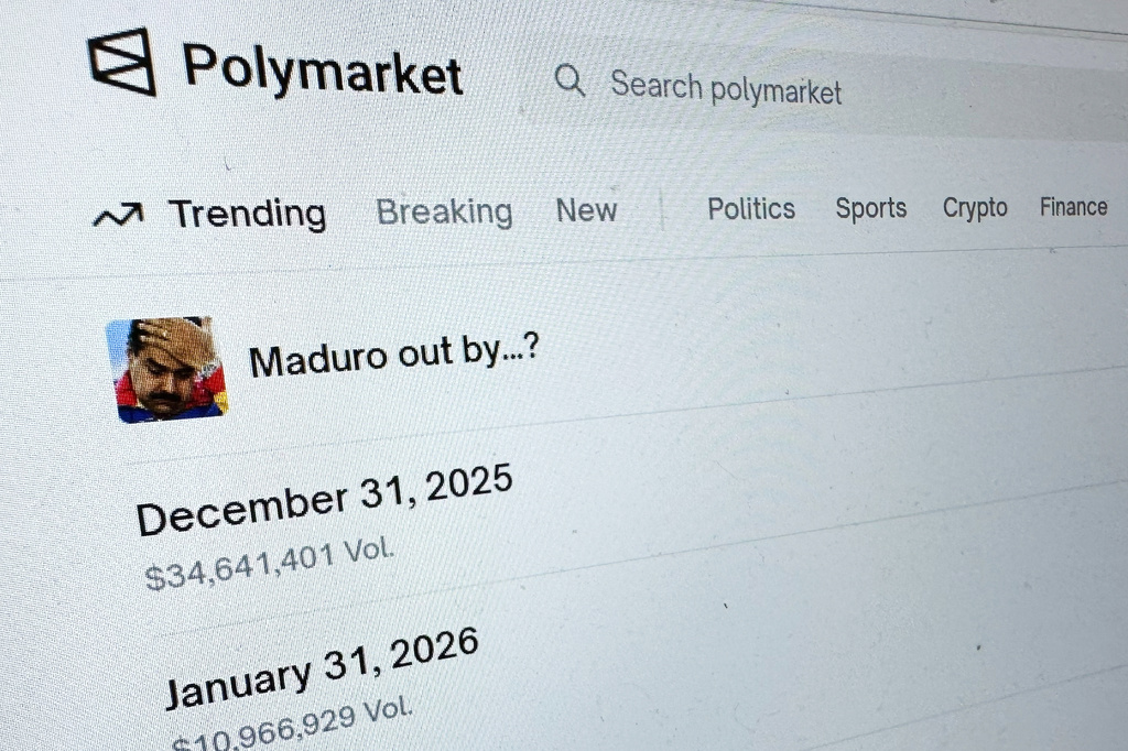 FILE - The Polymarket prediction market website is displayed on a computer screen, Jan. 11, 2026, in New York. (AP Photo/Wyatte Grantham-Philips, File)