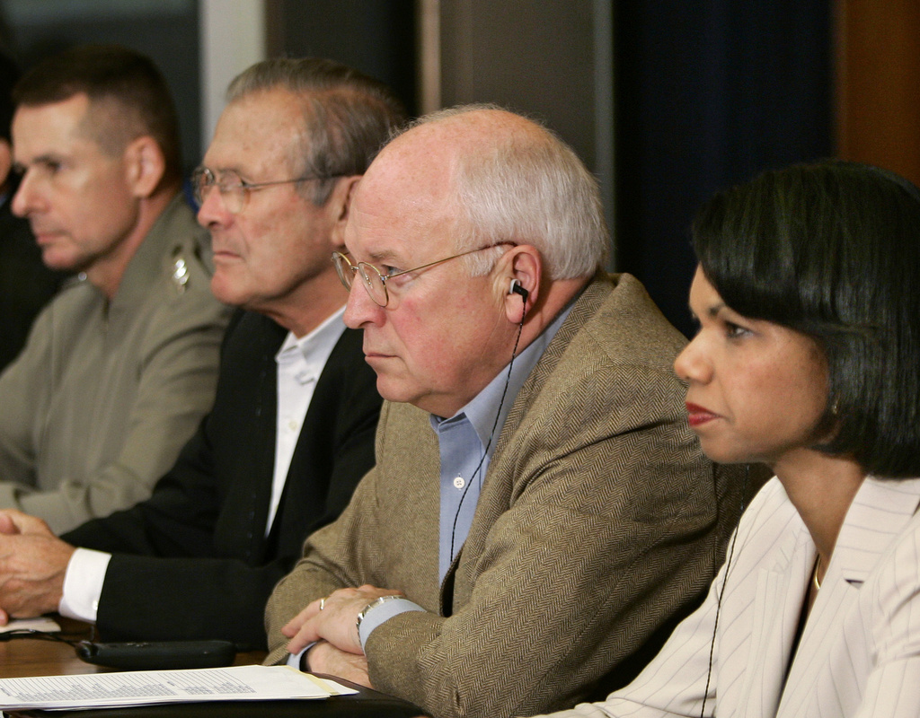 FILE - Watching President Bush and new Iraqi Prime Minister Nouri al-Maliki in Baghdad during a video teleconference at Camp David, Md., Tuesday, June 13, 2006, from right are, Secretary of State Condoleezza Rice, Vice President Dick Cheney, Secretary of Defense Donald H. Rumsfeld, and Joint Chiefs Chairman Gen. Peter Pace. In a surprise visit cloaked in secrecy, Bush flew overnight to Baghdad to bolster support for Iraq's fledgling government and U.S. war policy at home. (AP Photo/J. Scott Applewhite, file)