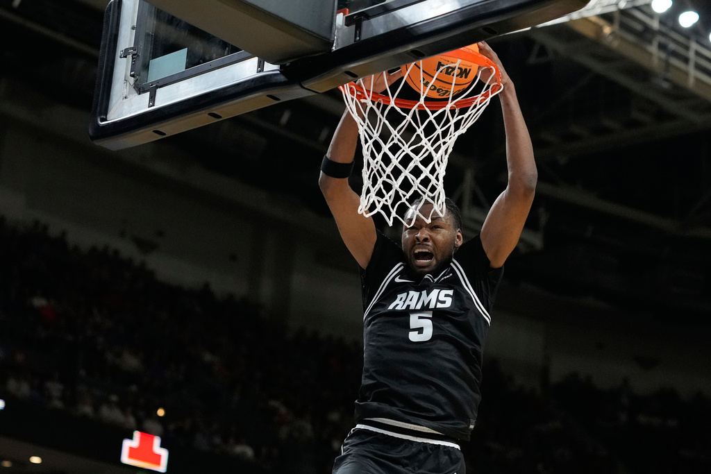 Virginia Commonwealth forward Barry Evans dunks during the first halfagainst Illinois in the second round of the NCAA college basketball tournament Saturday, March 21, 2026, in Greenville, S.C. (AP Photo/Brynn Anderson)