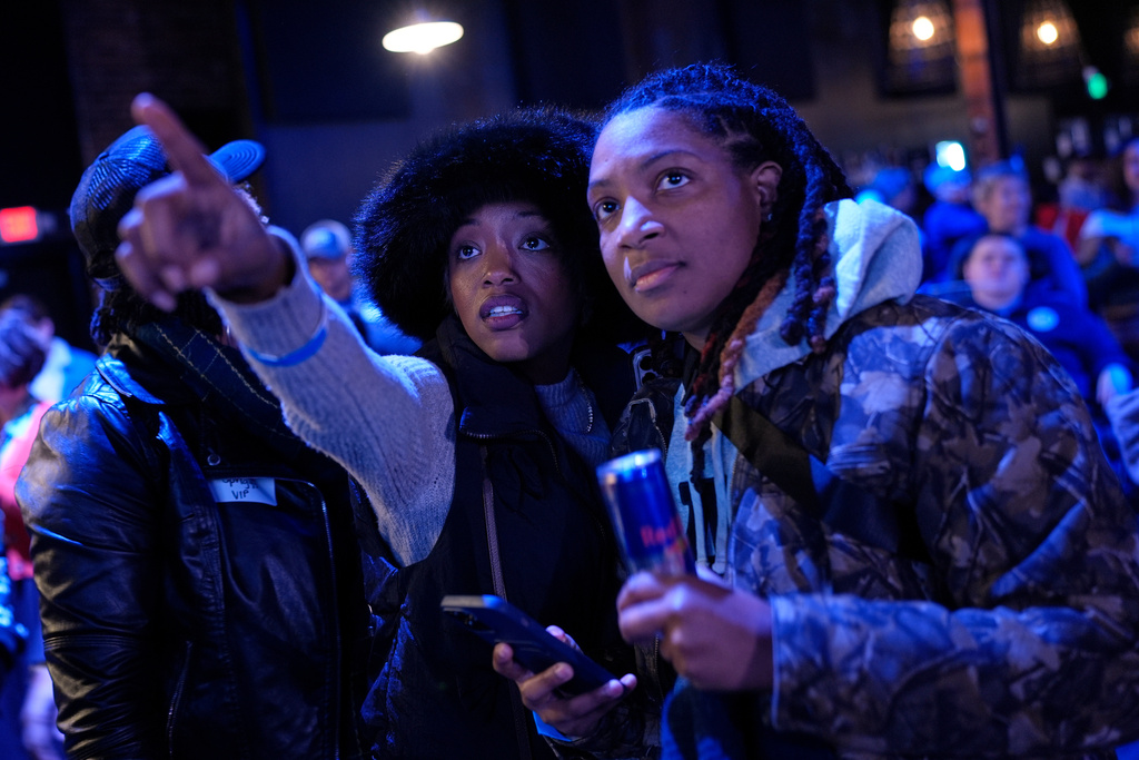 Democratic candidate Aftyn Behn supporters Jess Williams, left, and Tamara Bates, react to election results at a watch party for special election for the U.S. seventh congressional district, Tuesday, Dec. 2, 2025, in Nashville, Tenn. (AP Photo/George Walker IV)