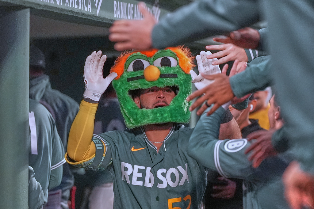 Boston Red Sox's Wilyer Abreu is congratulated after his solo home run during the third inning of a baseball game against the Tampa Bay Rays, Friday, May 8, 2026, in Boston. (AP Photo/Charles Krupa)