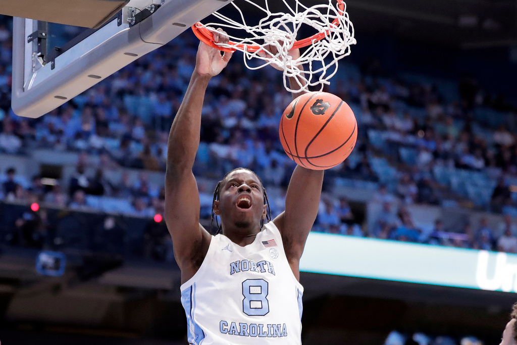 North Carolina forward Caleb Wilson (8) dunks during the first half of an NCAA college basketball game against North Carolina Central Friday, Nov. 14, 2025, in Chapel Hill, N.C. (AP Photo/Chris Seward)