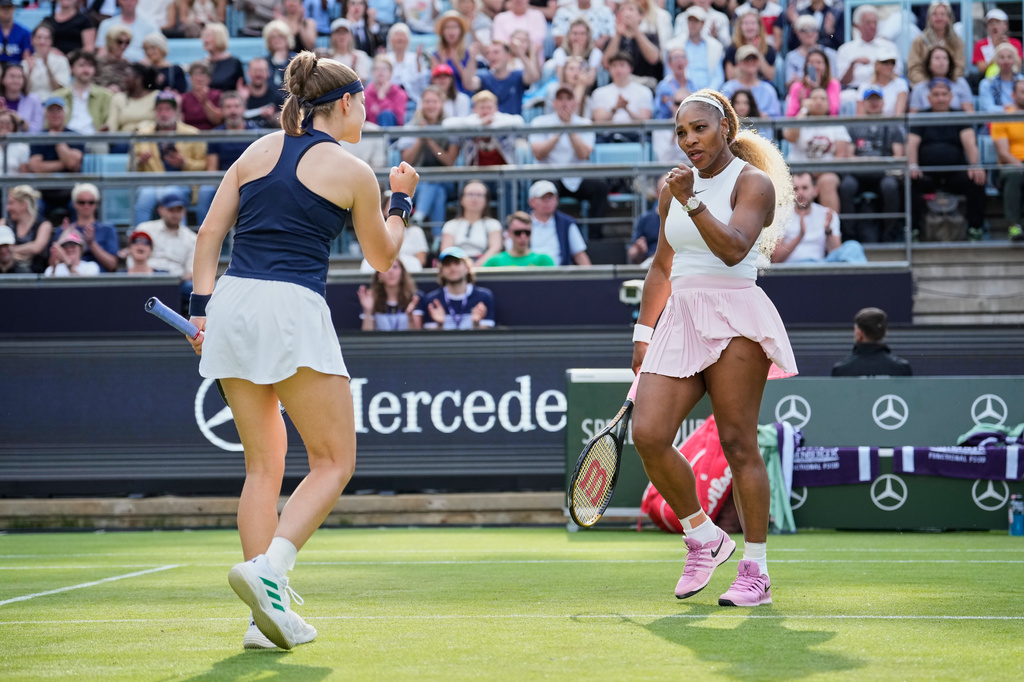Serena Williams of the U.S., right, reacts as she and Czech Republic's Karolina Muchova play during their round of 16 doubles match against New Zealand's Erin Routliffe and Mexico's Giuliana Olmo during the WTA 500 Berlin Open tennis tournament at Steffi Graf Stadium, in Berlin, Germany, Tuesday, June 16, 2026. (AP Photo/Ebrahim Noroozi)