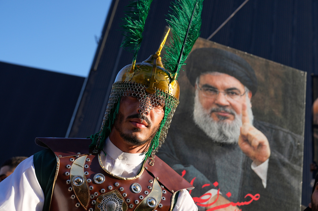 A Hezbollah supporter attends the holy day of Ashoura that commemorates the 7th century martyrdom of the Prophet Muhammad's grandson Hussein, in Dahiyeh, Beirut's southern suburbs, Lebanon, Friday, June 26, 2026. (AP Photo/Hussein Malla)