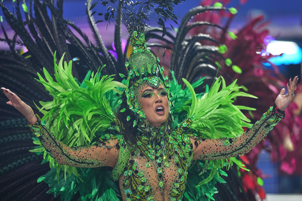 A dancer from the Colorado do Bras samba school performs during a carnival parade in Sao Paulo, Saturday, Feb. 14, 2026. (AP Photo/Andre Penner)