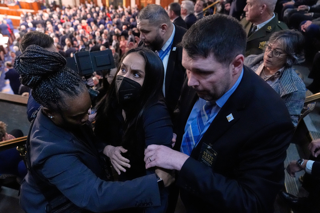 Aliya Rahman is removed from the House chamber as President Donald Trump delivers the State of the Union address to a joint session of Congress at the U.S. Capitol in Washington, Tuesday, Feb. 24, 2026. (AP Photo/Mark Schiefelbein)