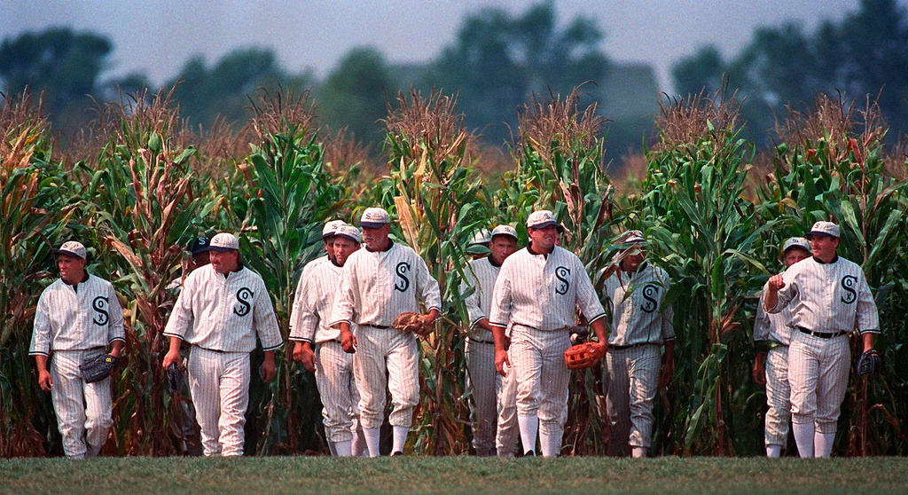 FILE - People portraying ghost players emerge from the cornfield at the "Field of Dreams" movie site in Dyersville, Iowa, on June 22, 1997. (AP Photo/Charlie Neibergall, File)