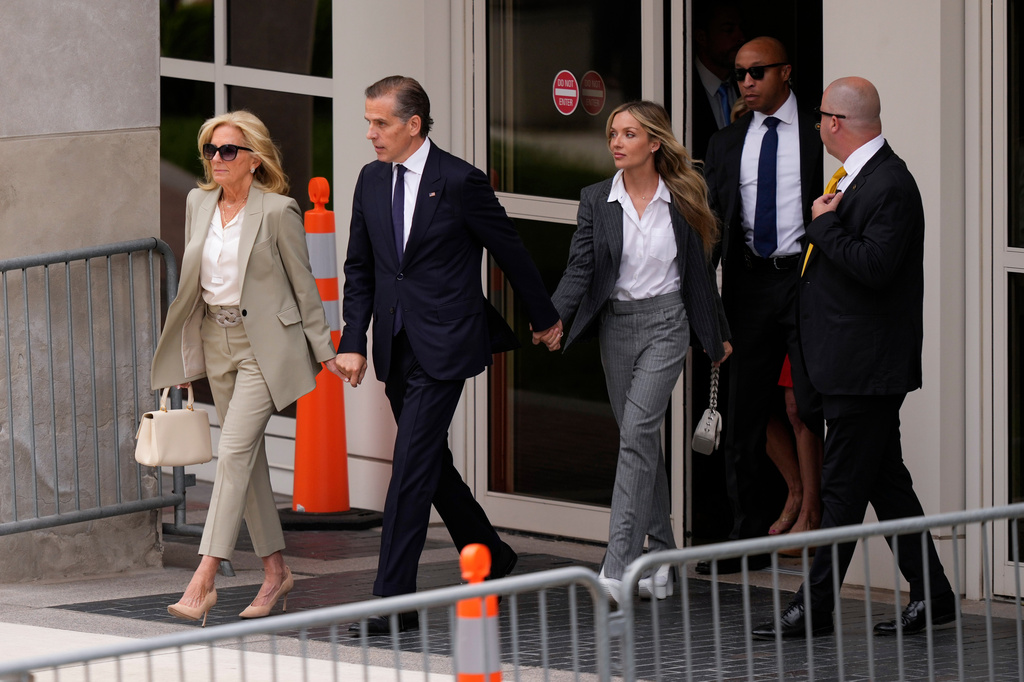 FILE - Hunter Biden, President Joe Biden's son, accompanied by his mother, first lady Jill Biden and his wife, Melissa Cohen Biden, walks out of federal court after hearing the verdict, June 11, 2024, in Wilmington, Del. Hunter Biden has been convicted of all 3 felony charges in the federal gun trial. (AP Photo/Matt Slocum, File)