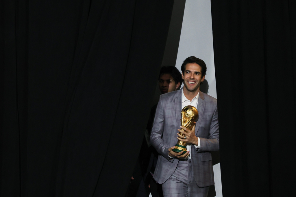 Former Brazilian soccer star Kaká, holding a World Cup trophy, enters for a panel on the 2026 FIFA World Cup soccer tournament halftime show during the Global Citizen NOW summit, Thursday, May 14, 2026, in New York. (AP Photo/Heather Khalifa)
