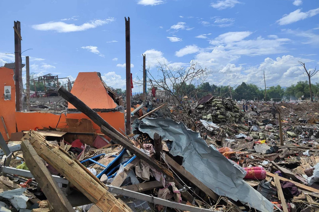 This handout photo provided by Palaung Land shows debris of the buildings destroyed in an explosion in Kaungtup village, Namhkam township, Shan State, Myanmar, on Sunday, May 31, 2026. (Palaung Land via AP)