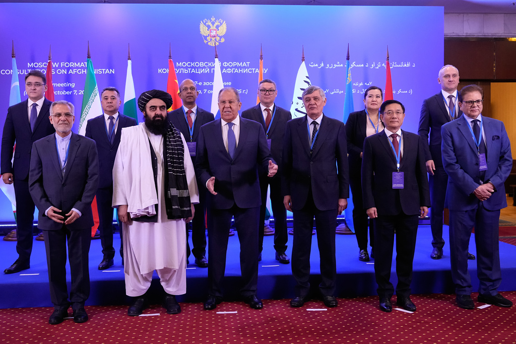 Afghanistan's Foreign Minister Amir Khan Muttaqi, second left in the first row, Russian Foreign Minister Sergey Lavrov, center in the first row, Russian presidential envoy to Afghanistan Zamir Kabulov, third right in the first row, and other representatives pose for a photo prior to their talks on the sidelines of the Moscow format consultations on Afghanistan in Moscow, Russia, Tuesday, Oct. 7, 2025. (AP Photo/Alexander Zemlianichenko)