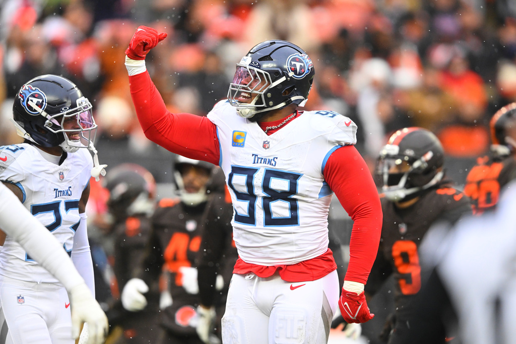 Tennessee Titans defensive tackle Jeffery Simmons (98) celebrates after sacking Cleveland Browns' Shedeur Sanders (12) in the first half of an NFL football game in Cleveland, Sunday, Dec. 7, 2025. (AP Photo/David Richard)