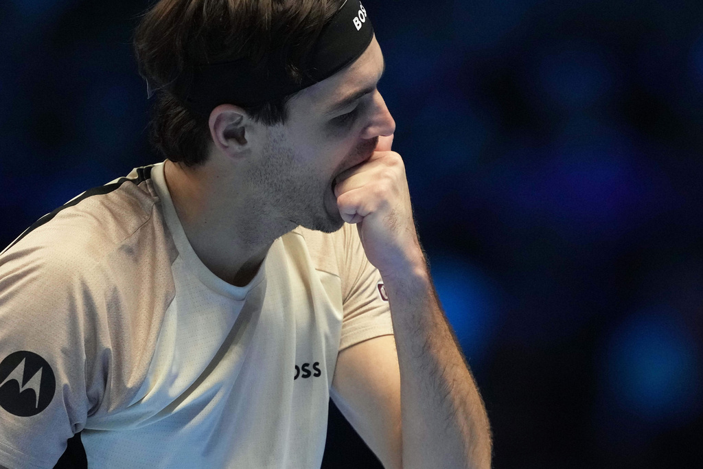 United States' Taylor Fritz reacts tduring a match against Italy's Lorenzo Musetti during their singles tennis match of the ATP World Tour Finals, in Turin, Italy, Monday, Nov. 10, 2025. (AP Photo/Antonio Calanni)