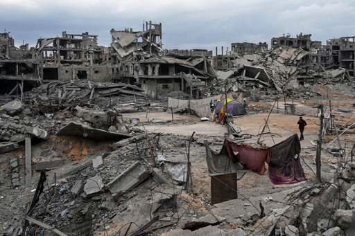 Displaced Palestinians set up their tents amid destroyed buildings at the Shati refugee camp in Gaza City, Sunday, Oct. 12, 2025, after Israel and Hamas agreed to a pause in their war and the release of the remaining hostages. (AP Photo/Abdel Kareem Hana) Displaced Palestinians set up their tents amid destroyed buildings at the Shati refugee camp in Gaza City, Sunday, Oct. 12, 2025, after Israel and Hamas agreed to a pause in their war and the release of the remaining hostages. (AP Photo/Abdel Kareem Hana)
