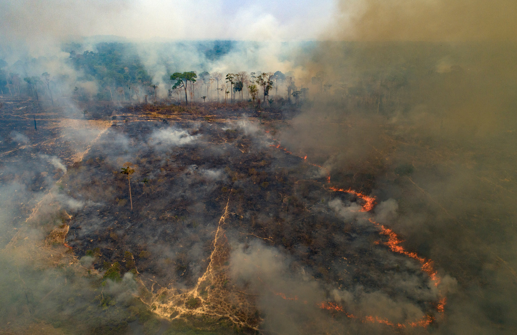 FILE - A wildfire consumes land recently deforested by cattle farmers near Novo Progresso, Para state, Brazil, Aug. 23, 2020. (AP Photo/Andre Penner, File)