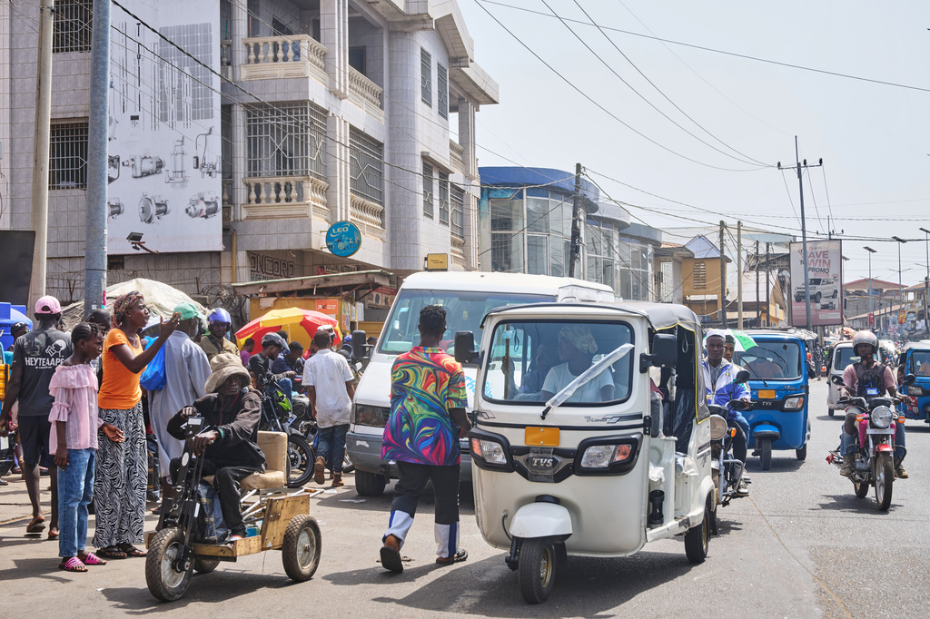 Hawa Mansaray transports a passenger in Freetown, Sierra Leone, March 7, 2026. (AP Photo/Abdul Hamid Kanu)