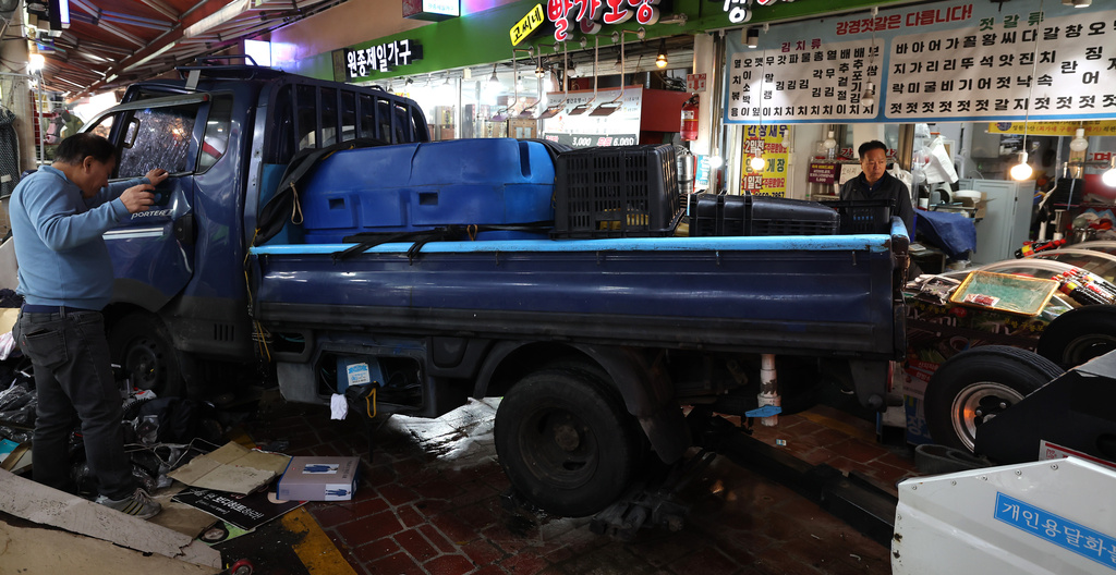 A truck crashes at a market in Bucheon, South Korea, Thursday, Nov. 13, 2025. (Jeon Jin-hwan/Newsis via AP)