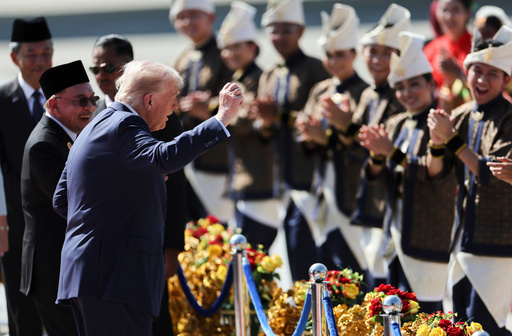 U.S. President Donald Trump reacts to dancing performers during a welcoming ceremony after arriving at Kuala Lumpur International Airport, to attend the 47th Association of Southeast Asian Nations (ASEAN) summit in Kuala Lumpur, Malaysia, Sunday, Oct. 26, 2025. (Hasnoor Hussain/Pool Photo via AP) U.S. President Donald Trump reacts to dancing performers during a welcoming ceremony after arriving at Kuala Lumpur International Airport, to attend the 47th Association of Southeast Asian Nations (ASEAN) summit in Kuala Lumpur, Malaysia, Sunday, Oct. 26, 2025. (Hasnoor Hussain/Pool Photo via AP)