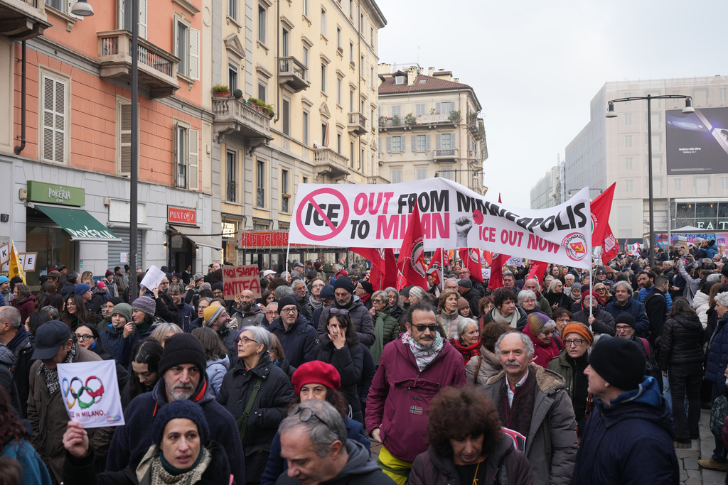 People take part in an Anti-ICE demonstration, ahead of the 2026 Winter Olympics, in Milan, Italy, Saturday, Jan. 31, 2026. (AP Photo/Antonio Calanni)