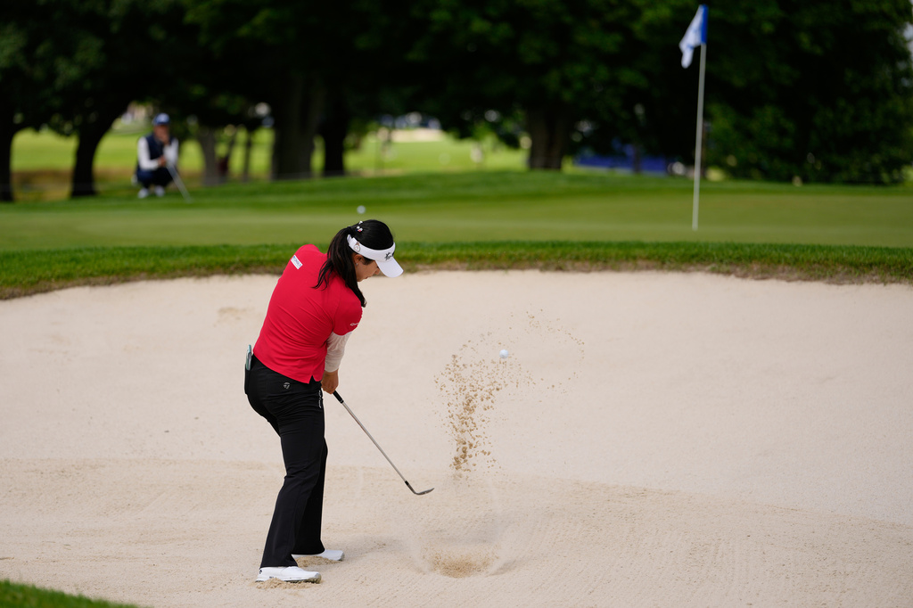 Ina Yoon, of South Korea, hits from a bunker on the second hole during the first round of the Women's PGA Championship golf tournament, Friday, June 25, 2026, in Chaska, Minn. (AP Photo/Chris Carlson)