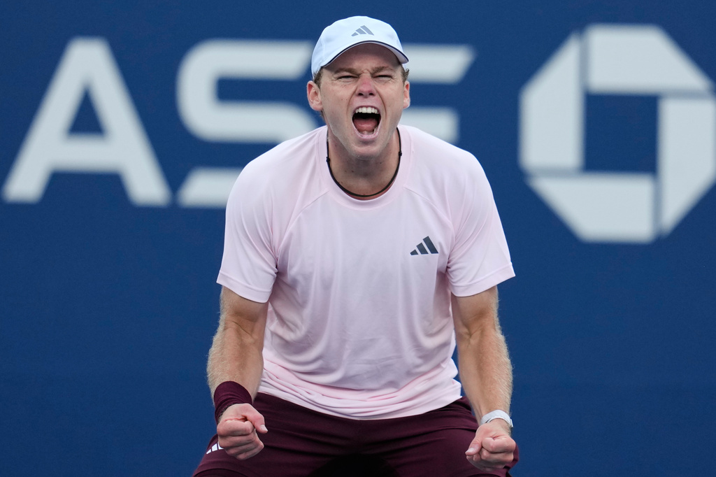 Alex Michelsen, of the United States, reacts after he won his match against Tomas Martin Etcheverry, of Argentina, during the fourth round of the U.S. Open tennis championships Sunday, Sept. 6, 2026, in New York. (AP Photo/Seth Wenig)