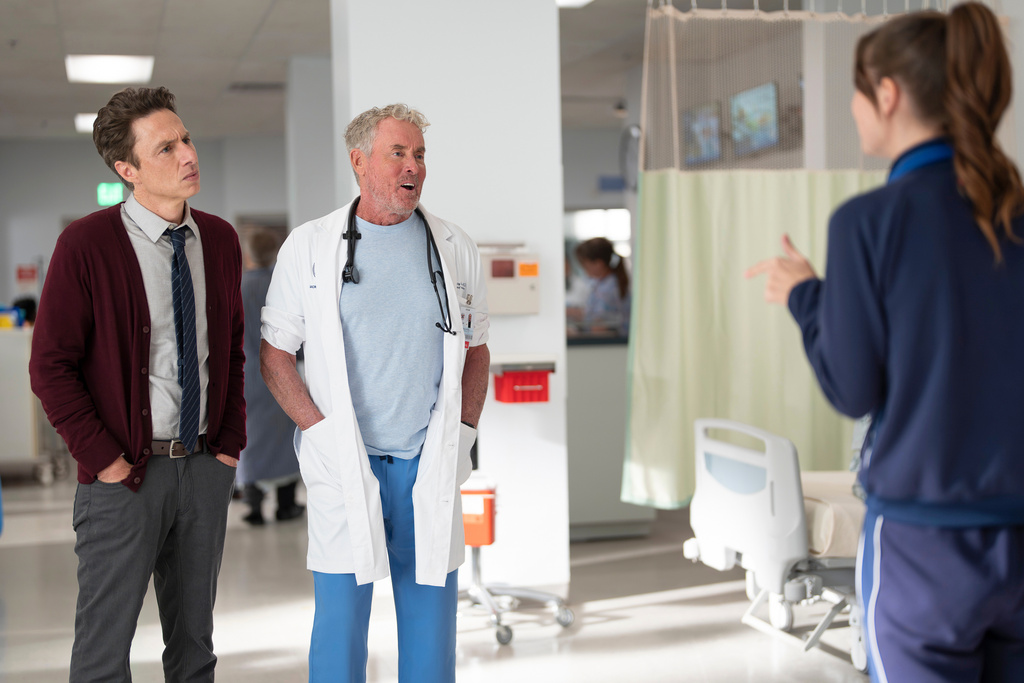 This image released by Disney shows, from left, Zach Braff, and John C. McGinley in a scene from "Scrubs." (Darko Sikman/Disney via AP)