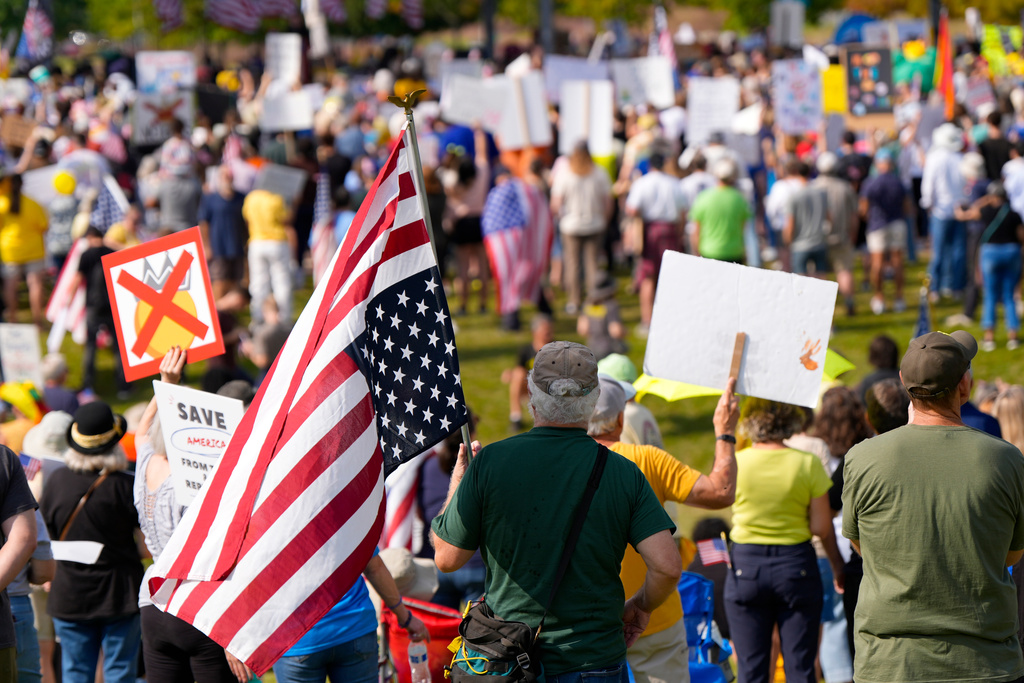 People participate in a "No Kings" rally, Saturday, Oct. 18, 2025, in Birmingham, Ala. (AP Photo/Mike Stewart)