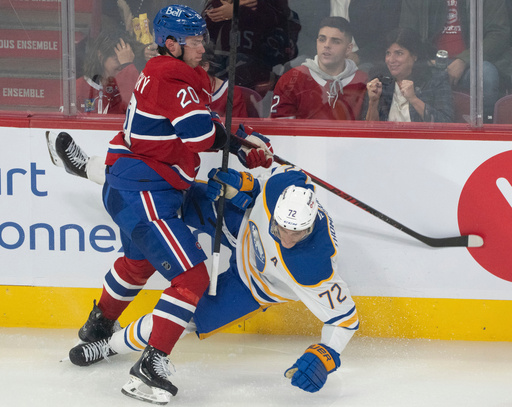 Buffalo Sabres' Tage Thompson (72) is checked into the boards by Montreal Canadiens' Juraj Slafkovský (20) during second period NHL hockey action in Montreal on Monday, Oct. 20, 2025. (Christinne Muschi/The Canadian Press via AP) Buffalo Sabres' Tage Thompson (72) is checked into the boards by Montreal Canadiens' Juraj Slafkovský (20) during second period NHL hockey action in Montreal on Monday, Oct. 20, 2025. (Christinne Muschi/The Canadian Press via AP)