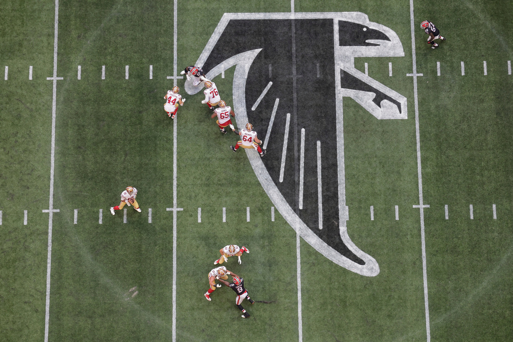 FILE - An aerial view of San Francisco 49ers offense and Atlanta Falcons defense at the midfield logo during the first half of an NFL football game, Sunday, Oct. 16, 2022, in Atlanta. (AP Photo/Stew Milne, File)