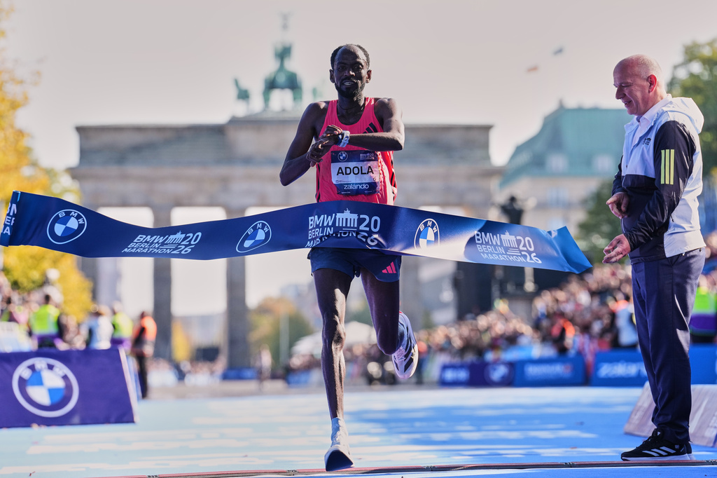 Ethiopia's Guye Adola crosses the finish line to win he Berlin Marathon in Berlin, Germany, Sunday, Sept. 27, 2026. (AP Photo/Ebrahim Noroozi)