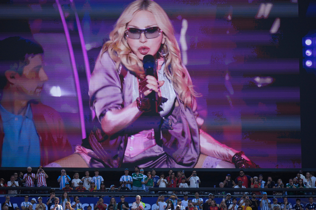 Spectators watch as Madonna performs during half time of the World Cup final soccer match between Spain and Argentina in East Rutherford, N.J., near New York, Sunday, July 19, 2026. (AP Photo/Frank Franklin II)