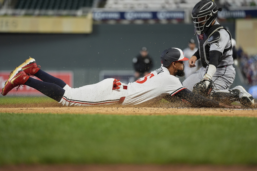 Minnesota Twins' Byron Buxton (25) is tagged out by Chicago White Sox catcher Edgar Quero during the fifth inning of a baseball game Wednesday, Sept. 3, 2025, in Minneapolis. (AP Photo/Abbie Parr)