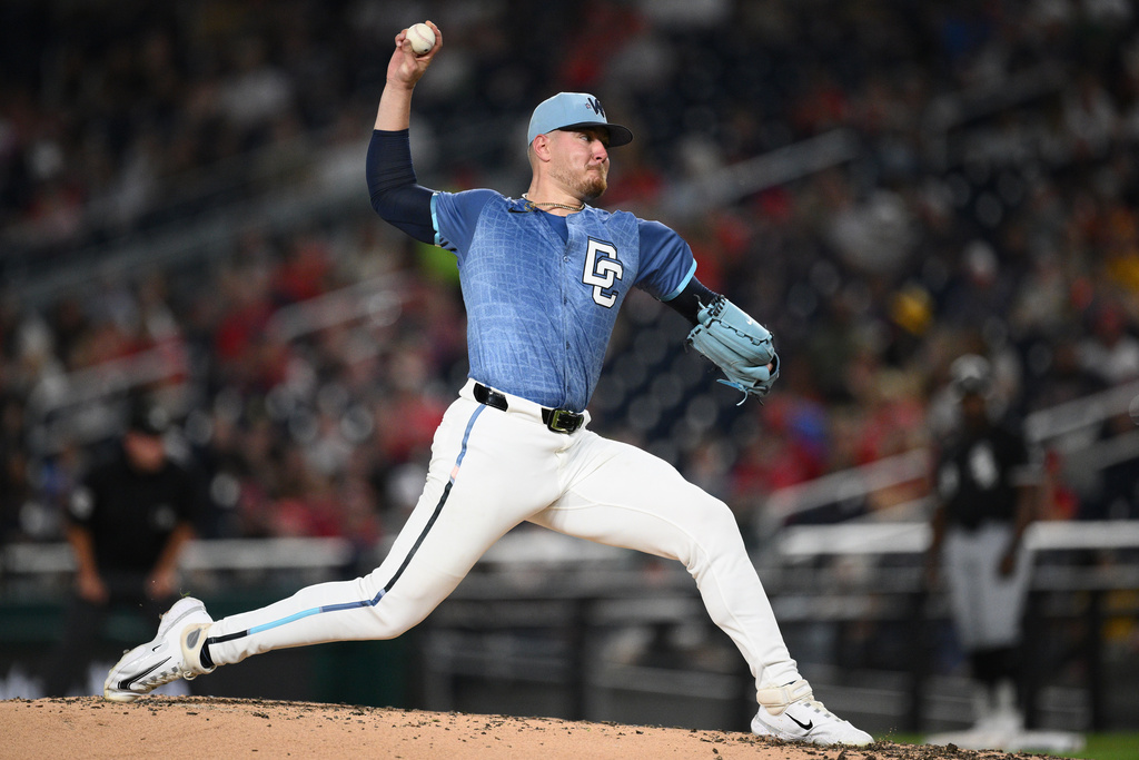Washington Nationals starting pitcher Cade Cavalli (24) throws during the third inning of a baseball game against the Chicago White Sox, Friday, Sept. 26, 2025, in Washington. (AP Photo/Nick Wass)