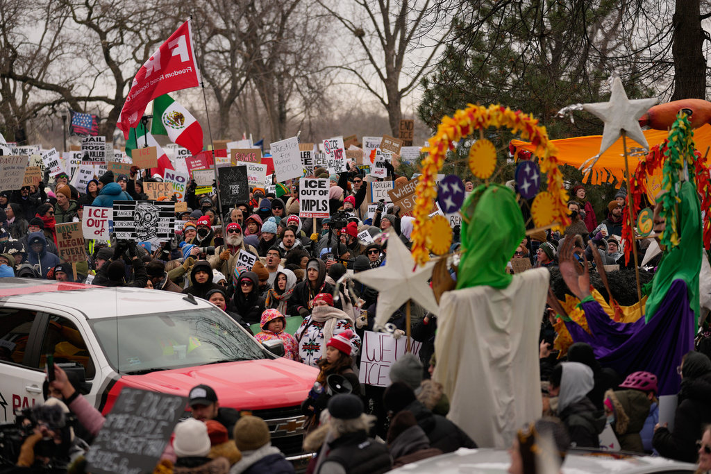 Protesters gather during a rally for Renee Good, who was fatally shot by an ICE officer earlier in the week, Saturday, Jan. 10, 2026, in Minneapolis. (AP Photo/John Locher)