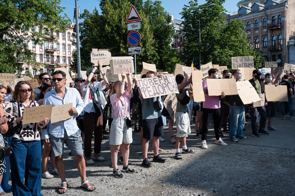 Ukranians gather to denounce President Volodymyr Zelenskyy's decision to dismiss Defense Minister Mykhailo Fedorov after six months in the post, Kyiv, Ukraine, Thursday, July 16, 2026. Placards read: "Power is the people", center left, and "Bring back Fedorov", center. (AP Photo/Danylo Antoniuk)