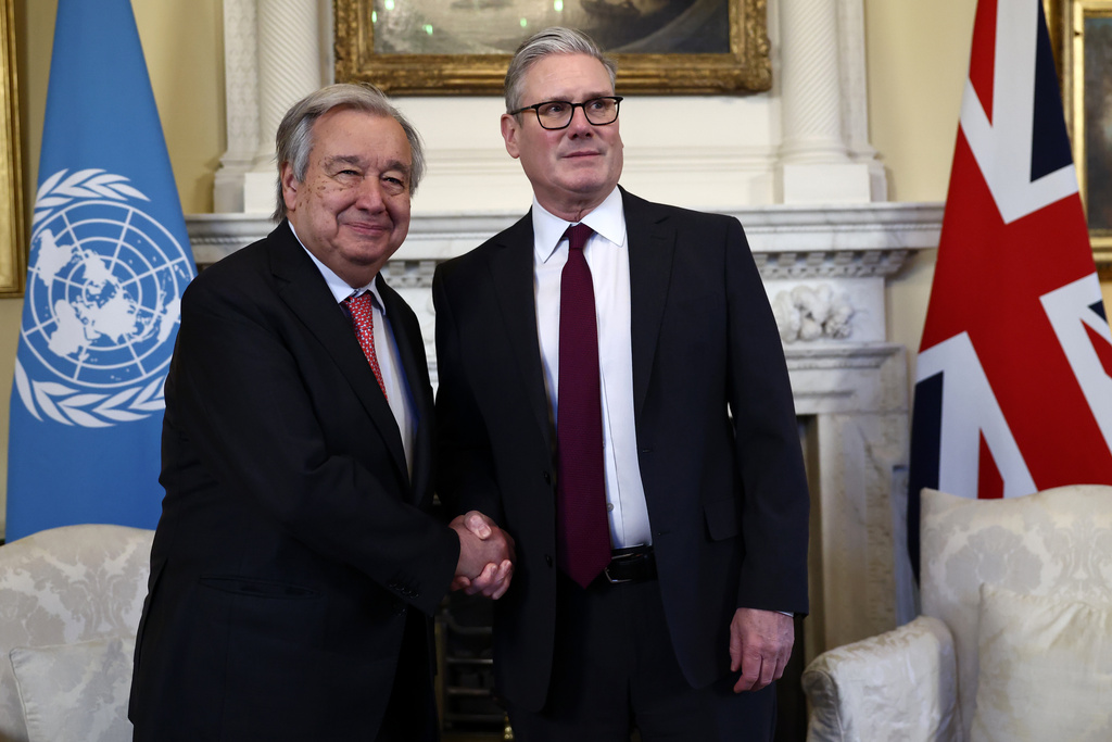 Britain's Prime Minister Keir Starmer, right, welcomes UN Secretary General António Guterres to 10 Downing Street, London, Friday, Jan. 16, 2026. (Henry Nicholls/Pool Photo via AP)