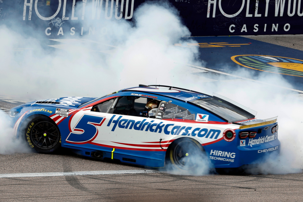 Kyle Larson does a burnout after winning a NASCAR Cup Series auto race in Kansas City, Kan., Sunday, Sept. 27, 2026. (AP Photo/Colin E. Braley)