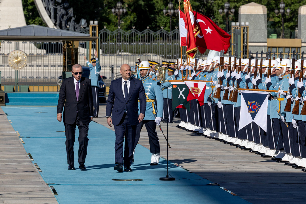 Turkish President Recep Tayyip Erdogan, left, and his Lebanese counterpart Joseph Aoun review an honor guard during a welcome ceremony before their meeting at the presidential palace in Ankara, Thursday, July 30, 2026. (Ugur Yildirim/DIA Photo via AP)
