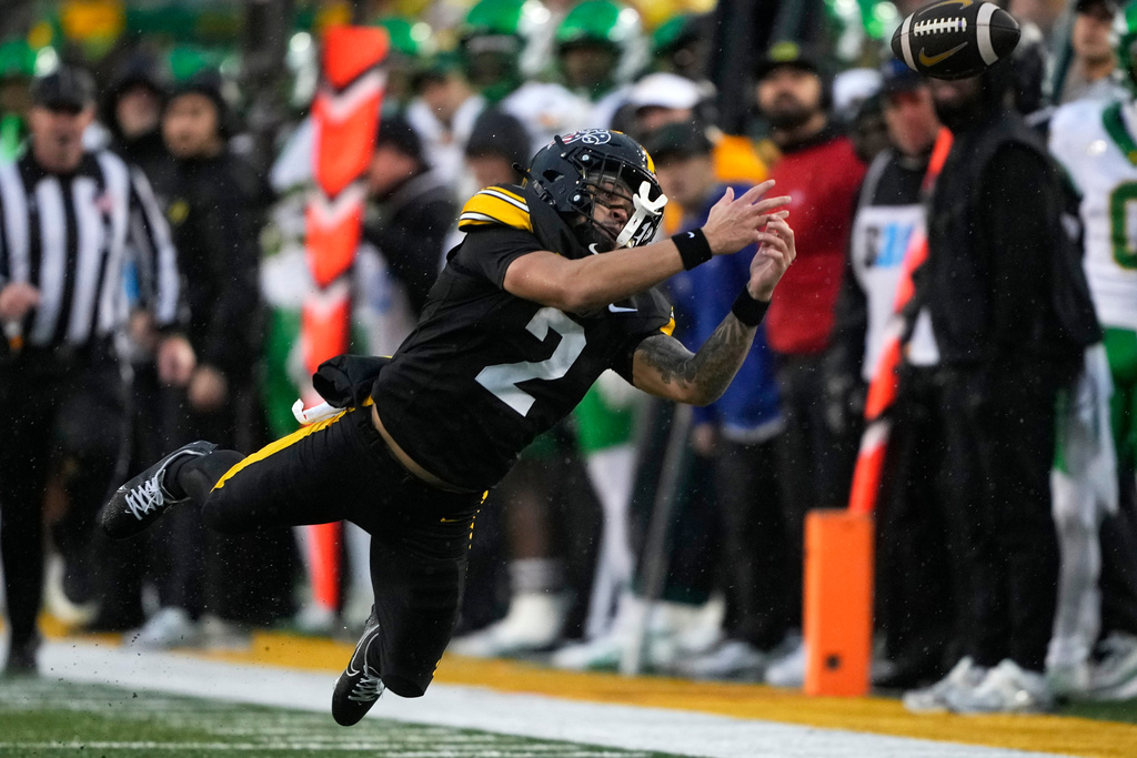 Iowa wide receiver Sam Phillips (2) reaches for an incomplete pass during the first half of an NCAA college football game against Oregon, Saturday, Nov. 8, 2025, in Iowa City, Iowa. (AP Photo/Charlie Neibergall)