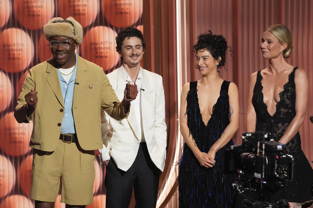 Taylor, the Creator, from left, Timothée Chalamet, Odessa A'zion, and Gwyneth Paltrow speak about "Marty Supreme" during the 32nd Annual Actor Awards on Sunday, March 1, 2026, at the Shrine Auditorium and Expo Hall in Los Angeles. (AP Photo/Chris Pizzello)