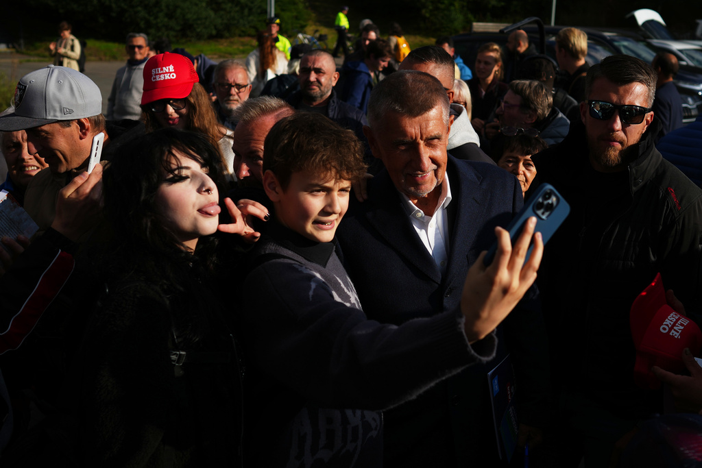 Chairman of opposition "ANO" (YES) movement Andrej Babis talks to his supporters during a rally ahead of Parliamentary elections in Prague, Czech Republic, Sept. 30, 2025. (AP Photo/Petr David Josek)