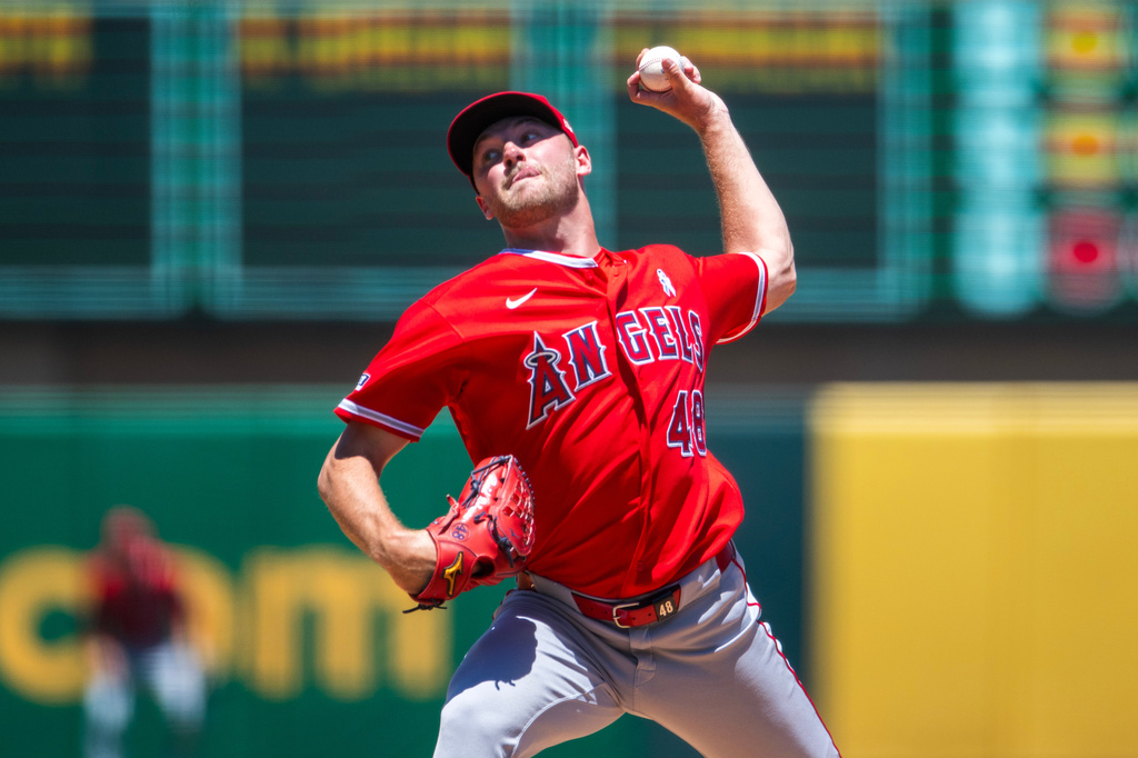 Los Angeles Angels pitcher Reid Detmers throws during the first inning of a baseball game against the Athletics in West Sacramento, Calif., Sunday, June 21, 2026. (AP Photo/Nic Coury)