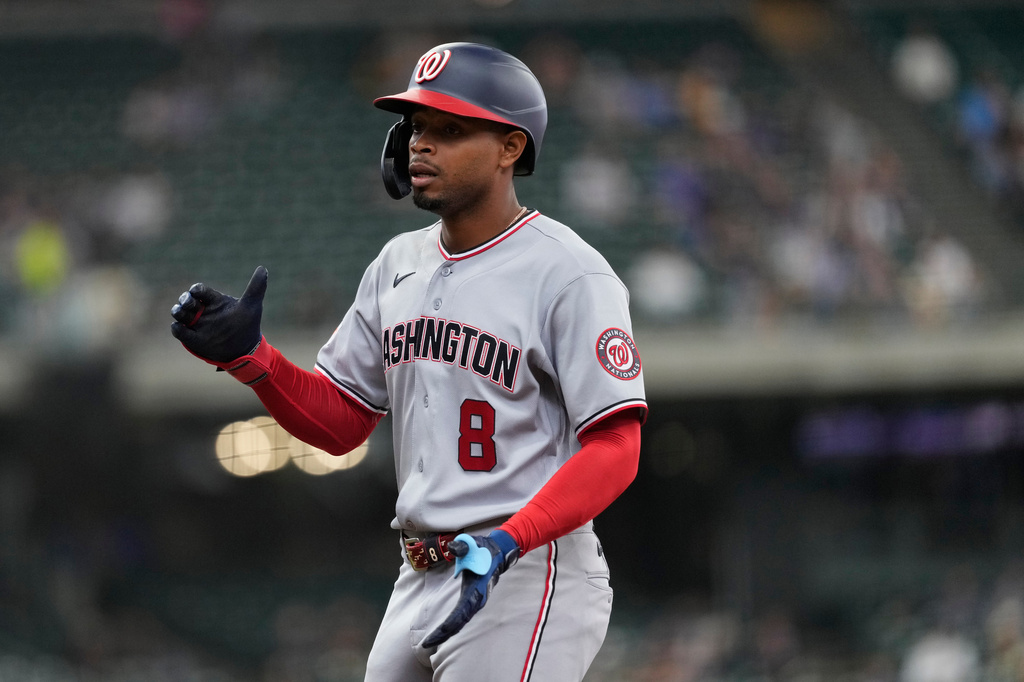 Washington Nationals' José Tena claps after hitting an RBI single during the seventh inning of a baseball game against the Milwaukee Brewers, Sunday, April 12, 2026, in Milwaukee. (AP Photo/Aaron Gash)