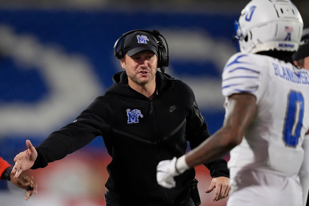 FILE - Memphis head coach Ryan Silverfield, left, celebrates a touchdown with wide receiver Demeer Blankumsee (0) during the first half of the Frisco Bowl NCAA college football game against West Virginia, Dec. 17, 2024, in Frisco, Texas. (AP Photo/LM Otero, File)