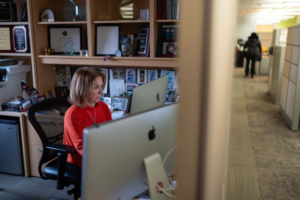 Dr. Mariana Kaplan, chief of the National Institute of Arthritis and Musculoskeletal and Skin Diseases at the National Institutes of Health, works in her office, Tuesday, Jan. 21, 2025, in Washington. (AP Photo/David Goldman)