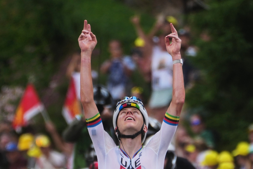 Slovenia's Tadej Pogacar celebrates as he crosses the finish line to win the sixth stage of the Tour de France cycling race with start in Pau and finish in Gavarnie-Gedre, France, Thursday, July 9, 2026. (AP Photo/Thibault Camus)