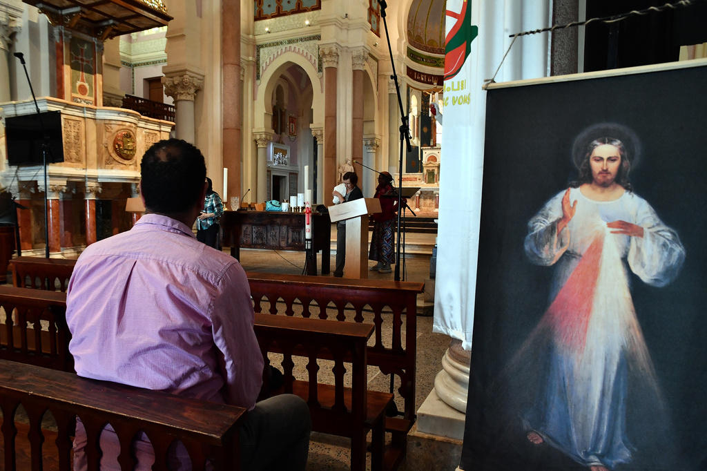 A man sits inside the Basilica of Saint Augustine in Annaba, eastern Algeria, Saturday, April 11, 2026, ahead of Pope Leo XIV's visit. (AP Photo/Fateh Guidoum)