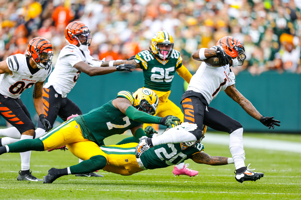 FILE - Cincinnati Bengals wide receiver Ja'Marr Chase (1) runs after a catch during a NFL football game against the Green Bay Packers, Oct. 12, 2025, in Green Bay, Wis. (AP Photo/Jeffrey Phelps, File)